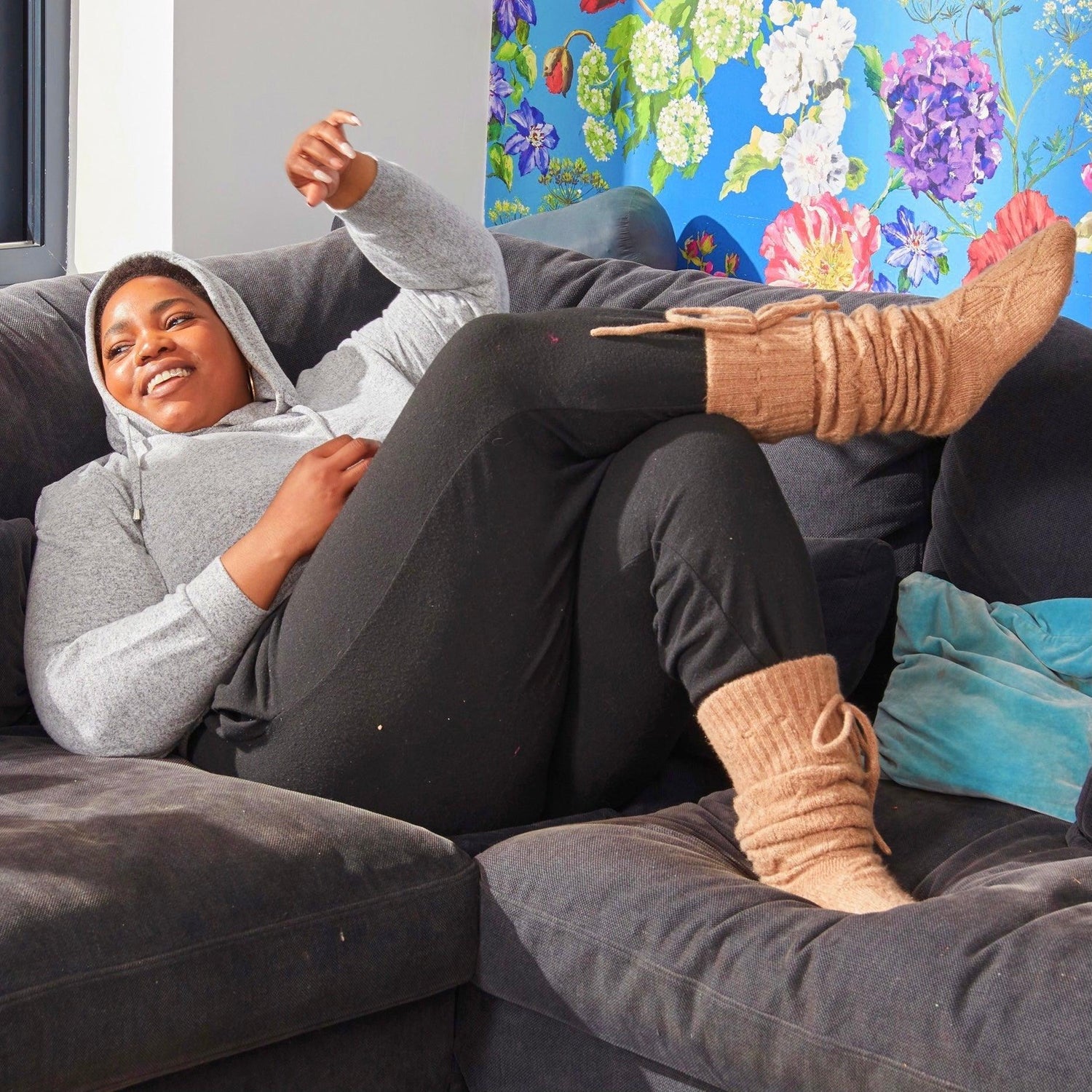 Woman wearing brown thigh high socks